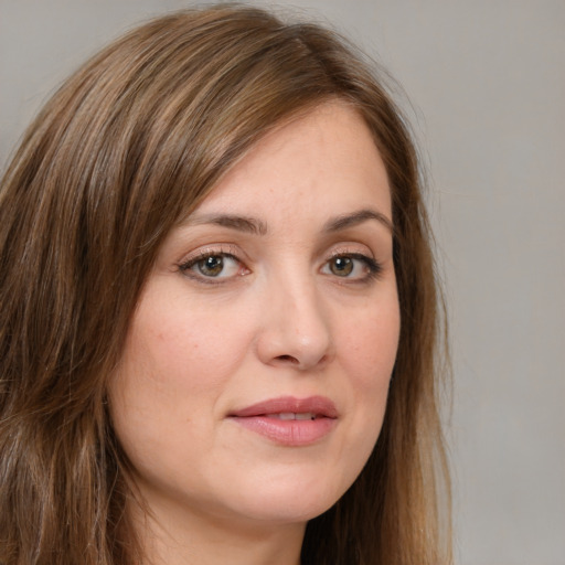 Joyful white young-adult female with long  brown hair and green eyes