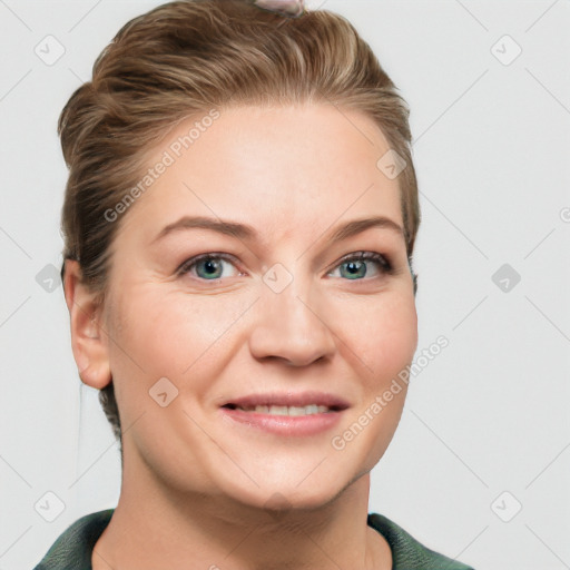 Joyful white young-adult female with short  brown hair and blue eyes