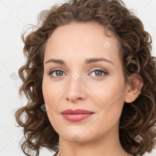 Joyful white young-adult female with medium  brown hair and green eyes