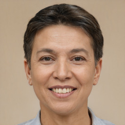 Joyful white adult female with short  brown hair and brown eyes