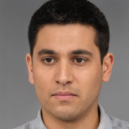 Neutral white young-adult male with short  black hair and brown eyes