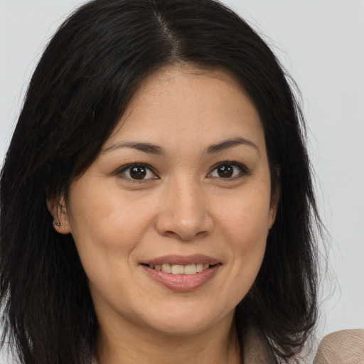 Joyful white young-adult female with medium  brown hair and brown eyes
