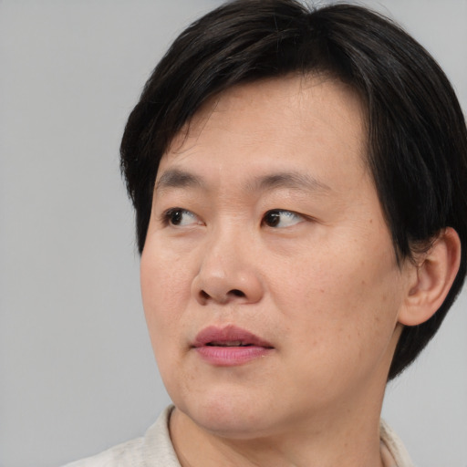 Neutral asian young-adult male with medium  brown hair and brown eyes
