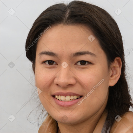 Joyful white young-adult female with long  brown hair and brown eyes