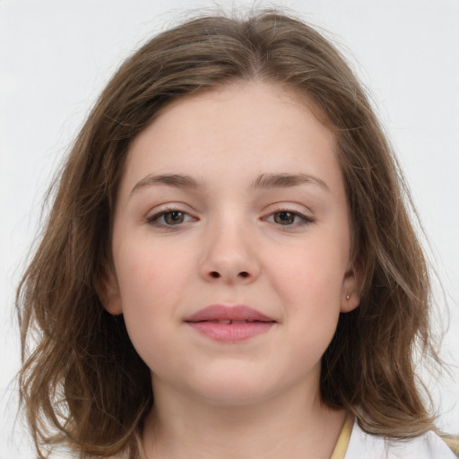 Joyful white child female with medium  brown hair and brown eyes