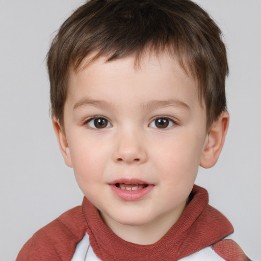 Joyful white child male with short  brown hair and brown eyes