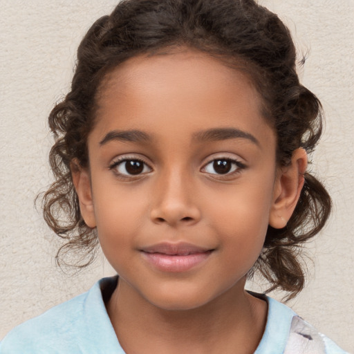 Joyful white child female with medium  brown hair and brown eyes