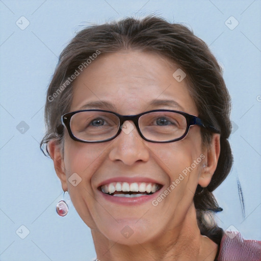 Joyful white adult female with medium  brown hair and blue eyes