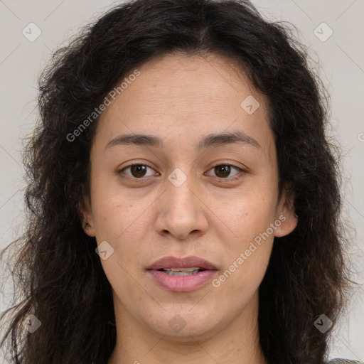 Joyful white adult female with long  brown hair and brown eyes