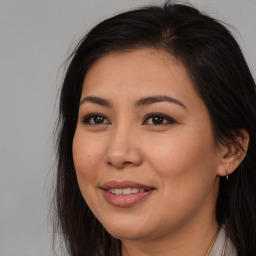 Joyful asian young-adult female with long  brown hair and brown eyes