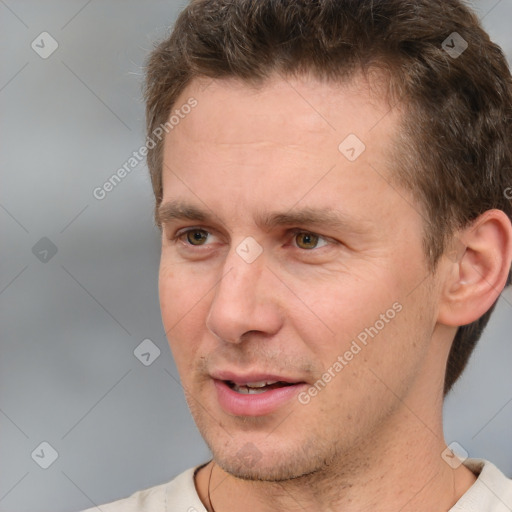 Joyful white adult male with short  brown hair and brown eyes