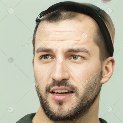 Joyful white young-adult male with short  black hair and brown eyes