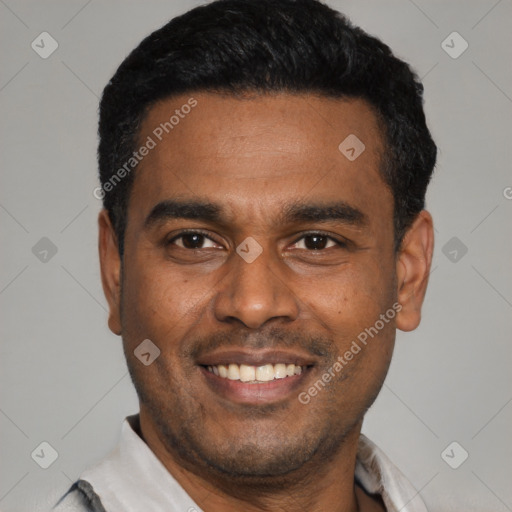 Joyful latino young-adult male with short  black hair and brown eyes