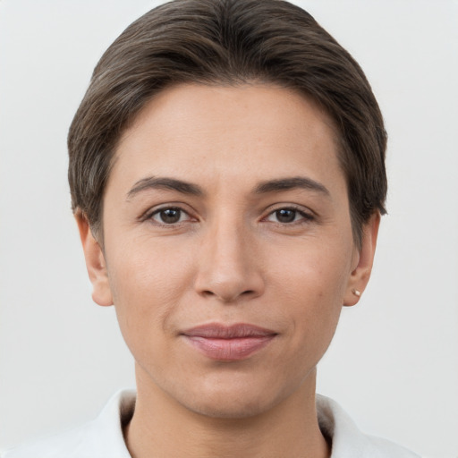 Joyful white young-adult female with short  brown hair and brown eyes