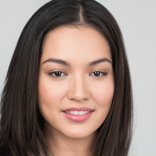 Joyful white young-adult female with long  brown hair and brown eyes