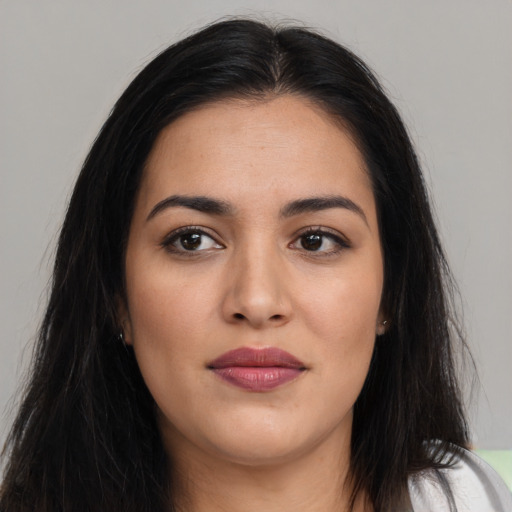 Joyful asian young-adult female with long  brown hair and brown eyes