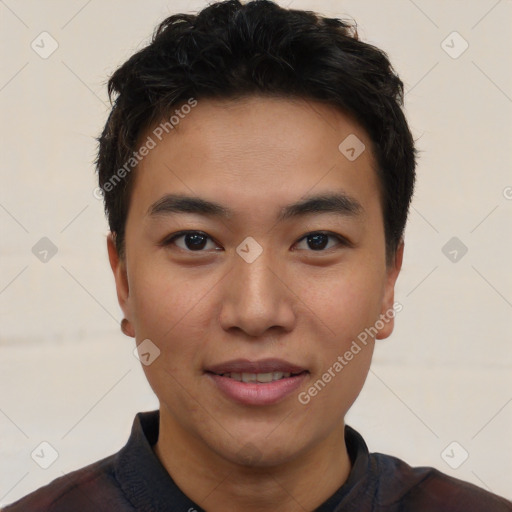 Joyful asian young-adult male with short  black hair and brown eyes