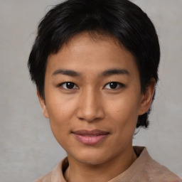 Joyful asian young-adult female with short  brown hair and brown eyes