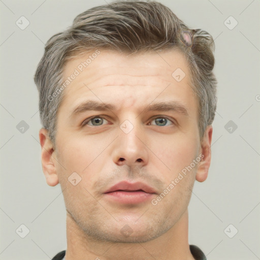 Neutral white adult male with short  brown hair and grey eyes