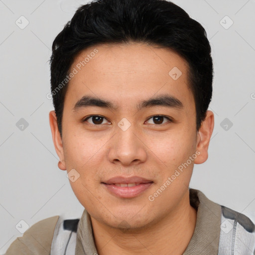 Joyful asian young-adult male with short  black hair and brown eyes