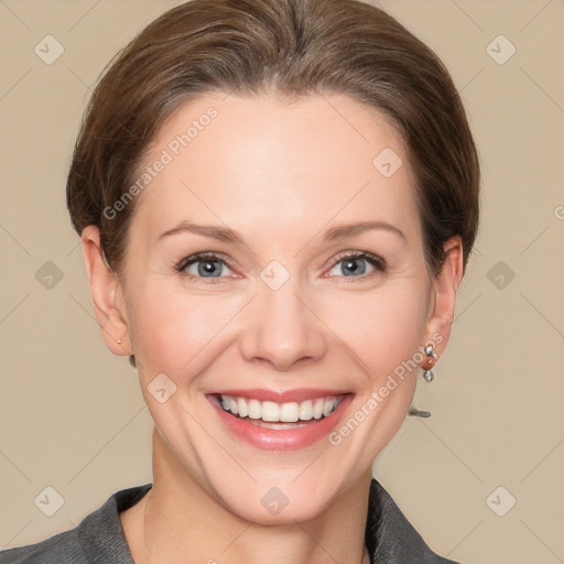 Joyful white young-adult female with short  brown hair and grey eyes