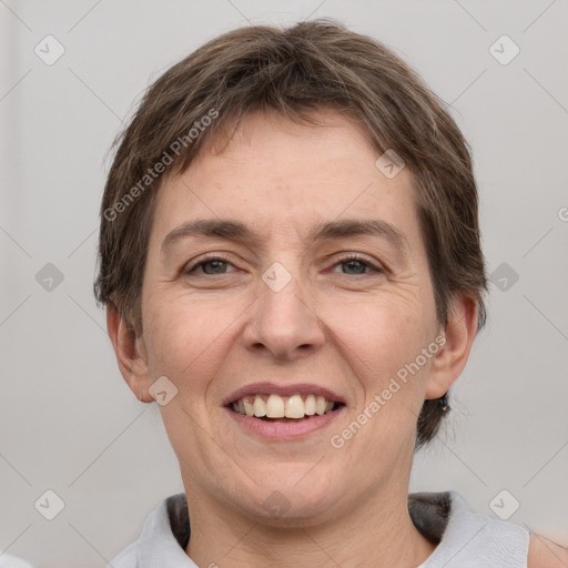 Joyful white adult female with short  brown hair and grey eyes