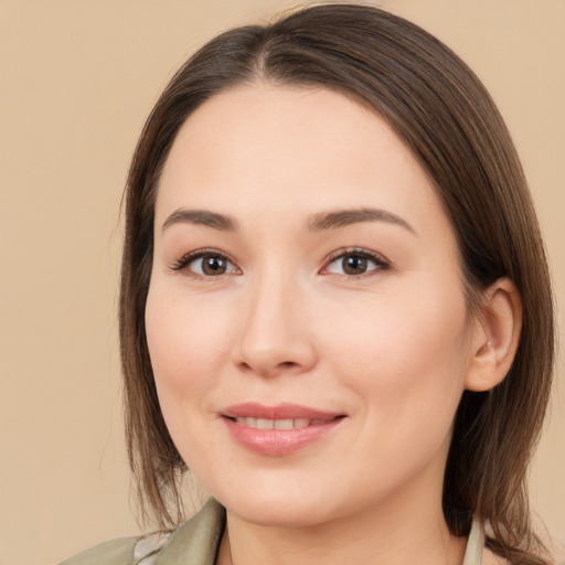 Joyful white young-adult female with medium  brown hair and brown eyes