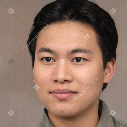 Joyful asian young-adult male with short  black hair and brown eyes