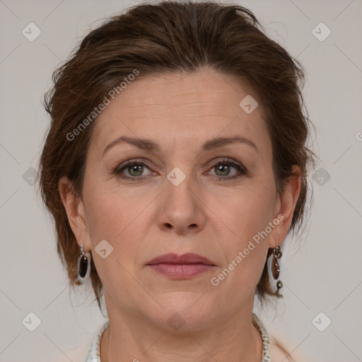 Joyful white adult female with medium  brown hair and grey eyes