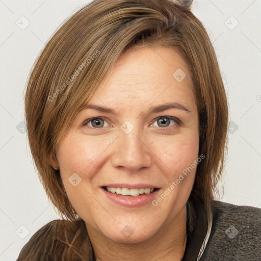 Joyful white adult female with medium  brown hair and grey eyes