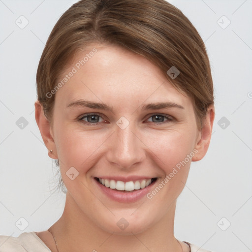 Joyful white young-adult female with short  brown hair and grey eyes