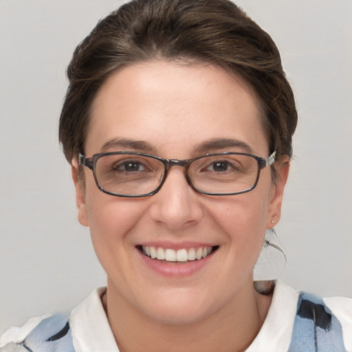 Joyful white adult female with short  brown hair and brown eyes