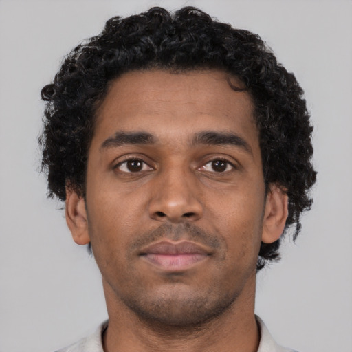 Neutral black young-adult male with short  brown hair and brown eyes