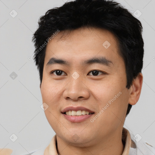 Joyful asian young-adult male with short  black hair and brown eyes