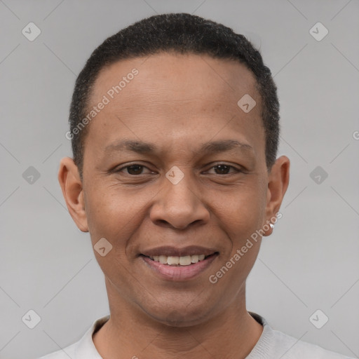 Joyful latino adult male with short  brown hair and brown eyes