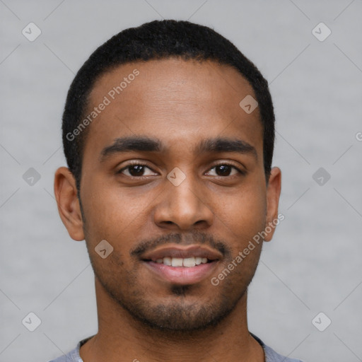 Joyful black young-adult male with short  brown hair and brown eyes