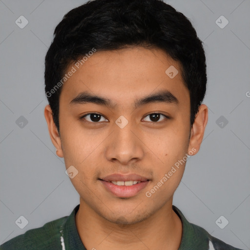 Joyful latino young-adult male with short  black hair and brown eyes