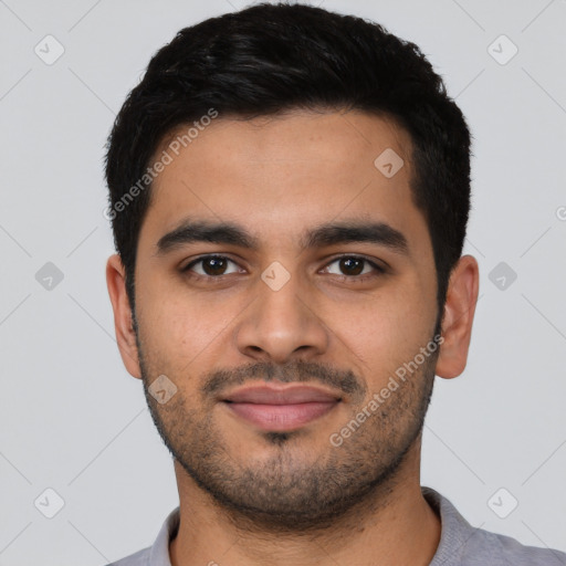 Joyful latino young-adult male with short  black hair and brown eyes