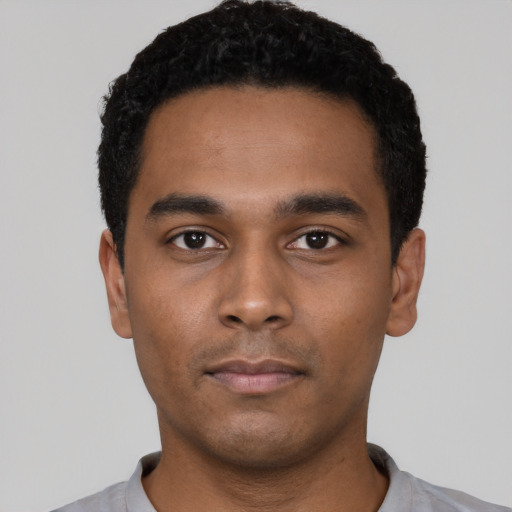 Neutral black young-adult male with short  black hair and brown eyes