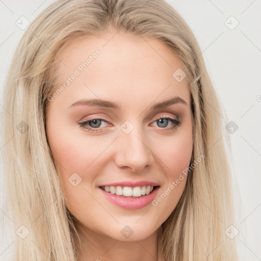 Joyful white young-adult female with long  brown hair and blue eyes