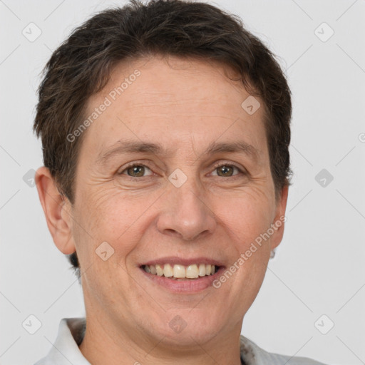 Joyful white adult female with short  brown hair and brown eyes