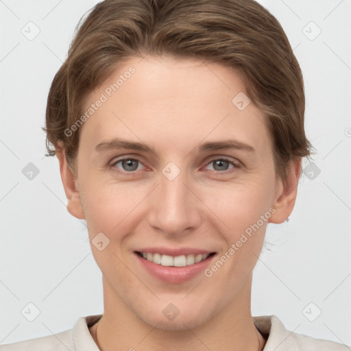 Joyful white young-adult female with short  brown hair and grey eyes