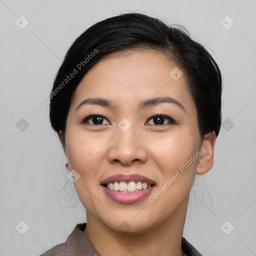 Joyful asian young-adult female with medium  black hair and brown eyes