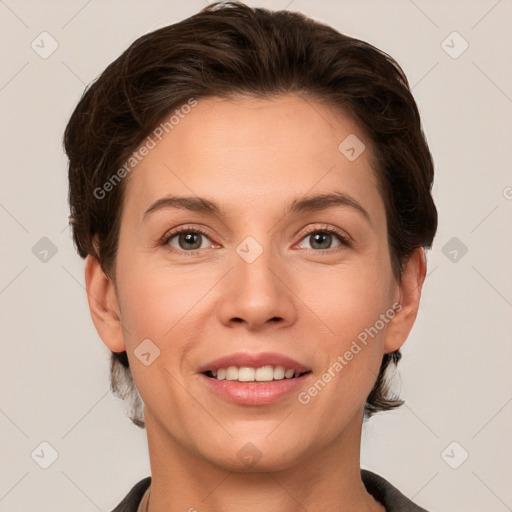 Joyful white young-adult female with short  brown hair and grey eyes