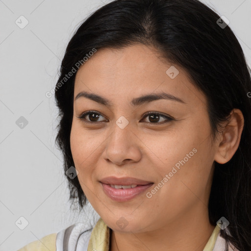 Joyful asian young-adult female with long  brown hair and brown eyes