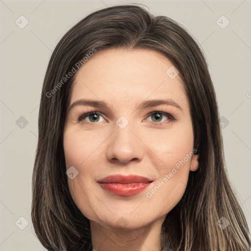 Joyful white young-adult female with long  brown hair and green eyes