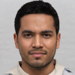 Neutral latino young-adult male with short  black hair and brown eyes