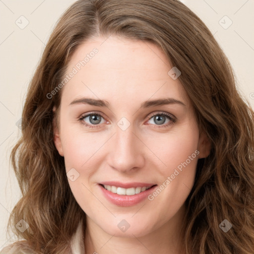 Joyful white young-adult female with long  brown hair and green eyes