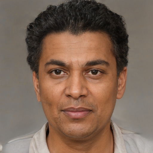 Neutral black adult male with short  black hair and brown eyes