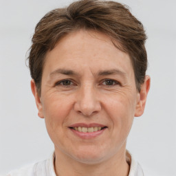 Joyful white adult female with short  brown hair and brown eyes